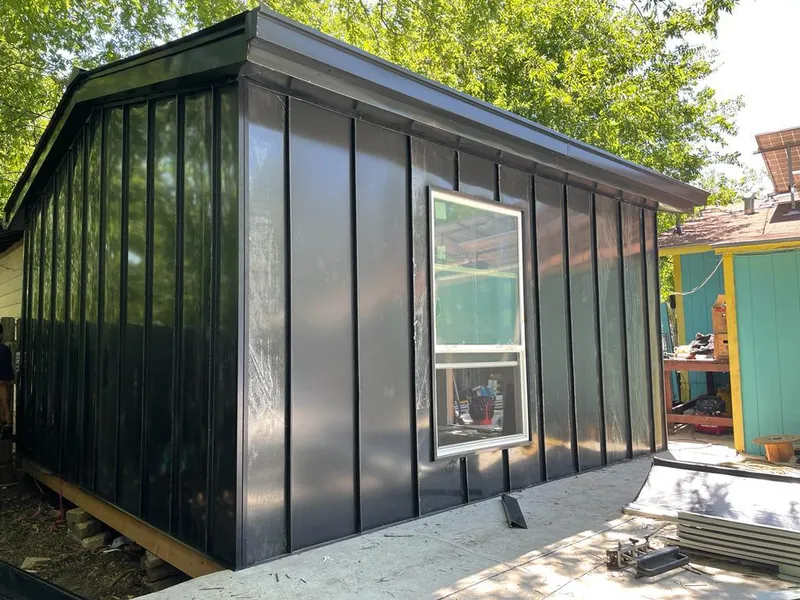 Black standing seam metal wall panels for Roof Inspection in Orchard Park