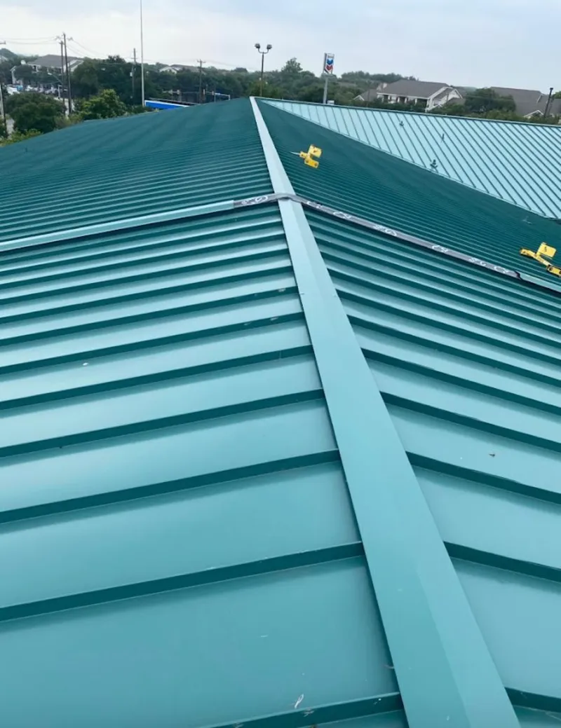 Green commercial metal roof ridge and valley for Metal Roof Repair in Orchard Park