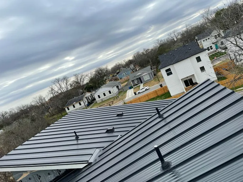 Standing seam metal roof panels with vents for Skylight Repair in Orchard Park